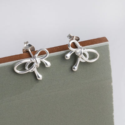 MK831 Sterling Silver Bow Studs 1