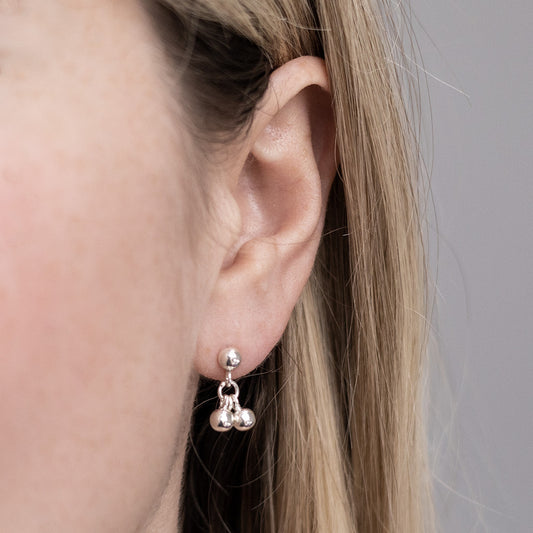 MK832 Sterling Silver Ball Bell Dangly Studs Model Shot