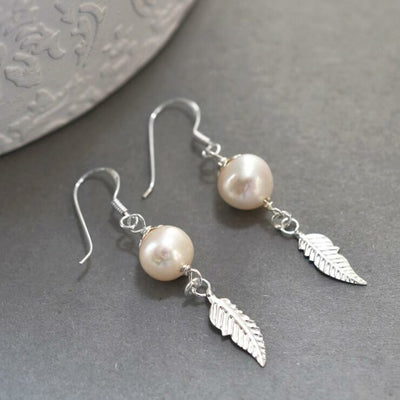 MK805 Sterling Silver Pearl And Feather Dangly Earrings