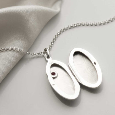 MC155 SILVER OVAL LOCKET NECKLACE WITH GARNET OPEN 1