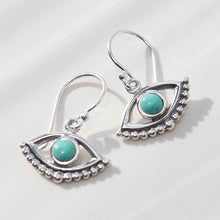 ML806T Sterling Silver Turquoise Evil Eye Dangly Earrings