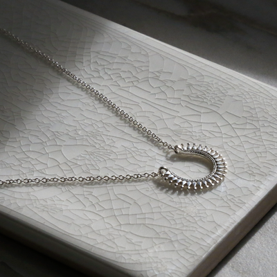 mzb101sterlingsilvertribalhorseshoenecklace1 1