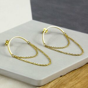 Gold Half Circle Hoops with chain on multi coloured background tile