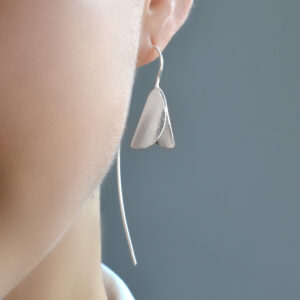 silver snowdrop on long ear wire worn by model