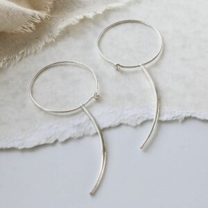 Sterling Silver Claw Earring With Claw on canvas and paper background