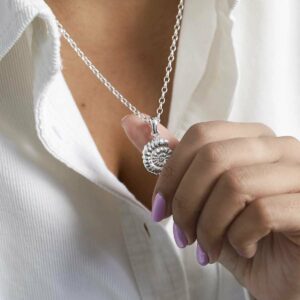 model Holding Ammonite Necklace