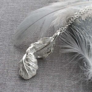 Silver furling feather pendant necklace