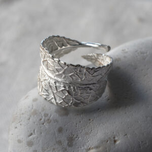 silver leaf imprinted ring on pebble