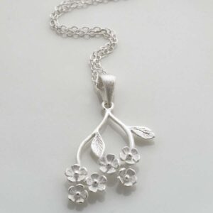 Silver forget me nots hanging from stem pendant necklace