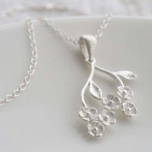 Silver forget me nots hanging from stem pendant necklace