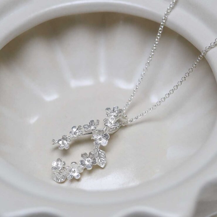 Sterling Silver Forget Me Not Cluster Necklace in jewellery dish