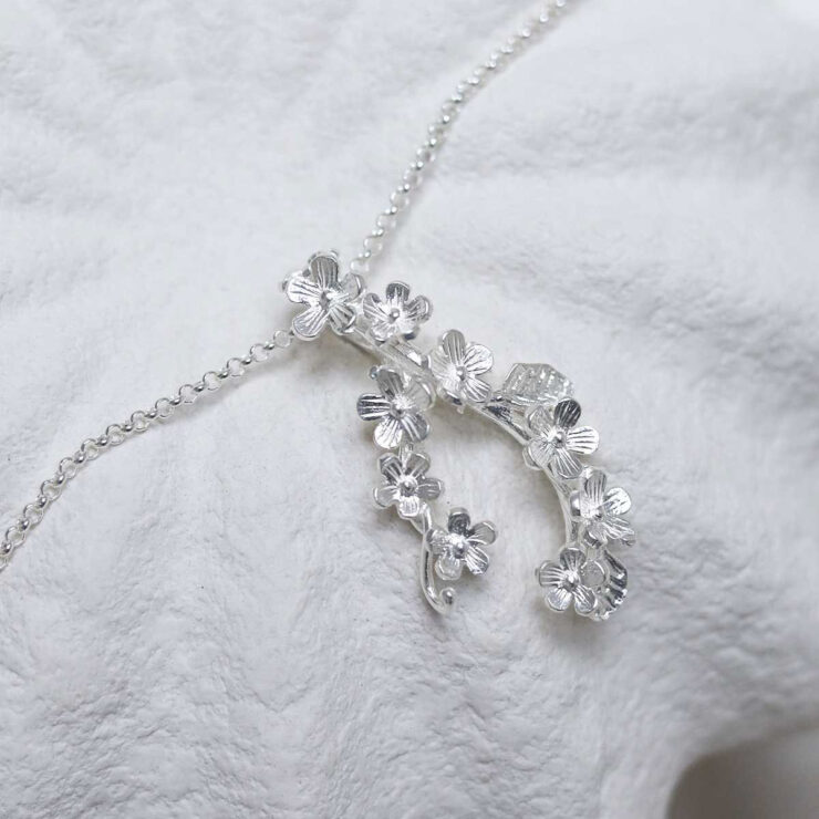 Sterling Silver Forget Me Not Cluster Necklace in jewellery dish