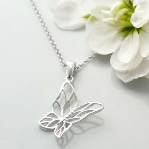 Silver cutout butterfly in flight pendant necklace