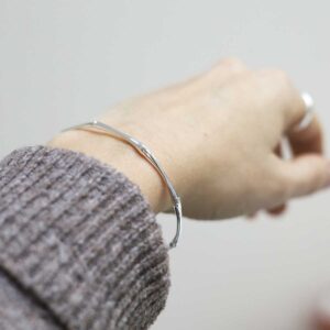 model wearing Sterling Silver Bamboo Bangle