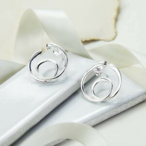 Polished silver twirling loop studs