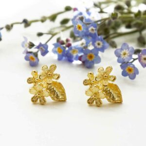 Gold Flower studs with forget me nots background