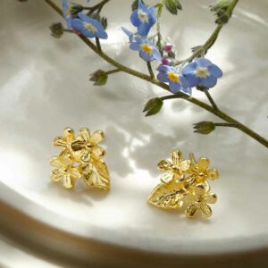 Gold Flower studs with forget me nots background