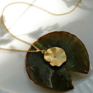 Gold Lily Pendant on lily pad