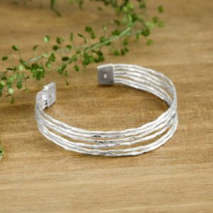 Silver rough textured bangle with clasp