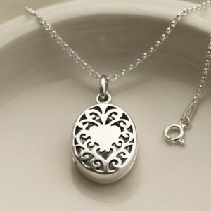 Sterling Silver Vintage Oval Locket on cream background