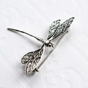 Silver dragonfly in flight brooch