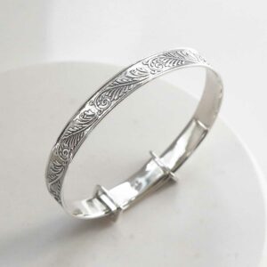 sterling silver shiny baby bangle on a white background