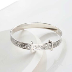 sterling silver shiny baby bangle on a white background