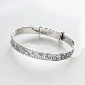 sterling silver shiny baby bangle on a white background