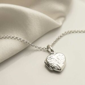 Sterling Silver Sweet Heart Locket on white background with silk detail