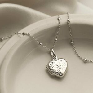 Sterling Silver Sweet Heart Locket with satellite chain on white background with silk detail