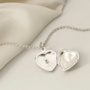 Sterling Silver Diamond Kissed Locket open on white background with silk detail