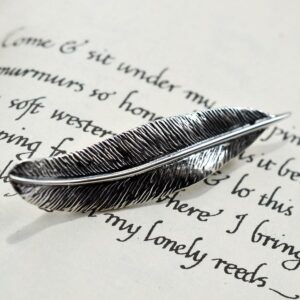 Silver detailed feather brooch