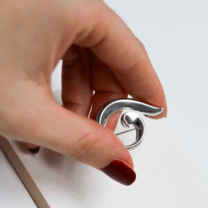 model holding Sterling Silver Spiral Brooch