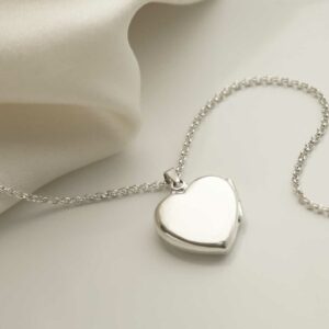 Sterling Silver Heart Locket on silk background