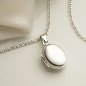 Sterling Silver Little Oval Locket on silk background