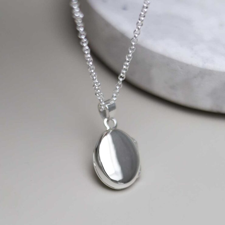 Sterling Silver Oval Locket Necklace on table