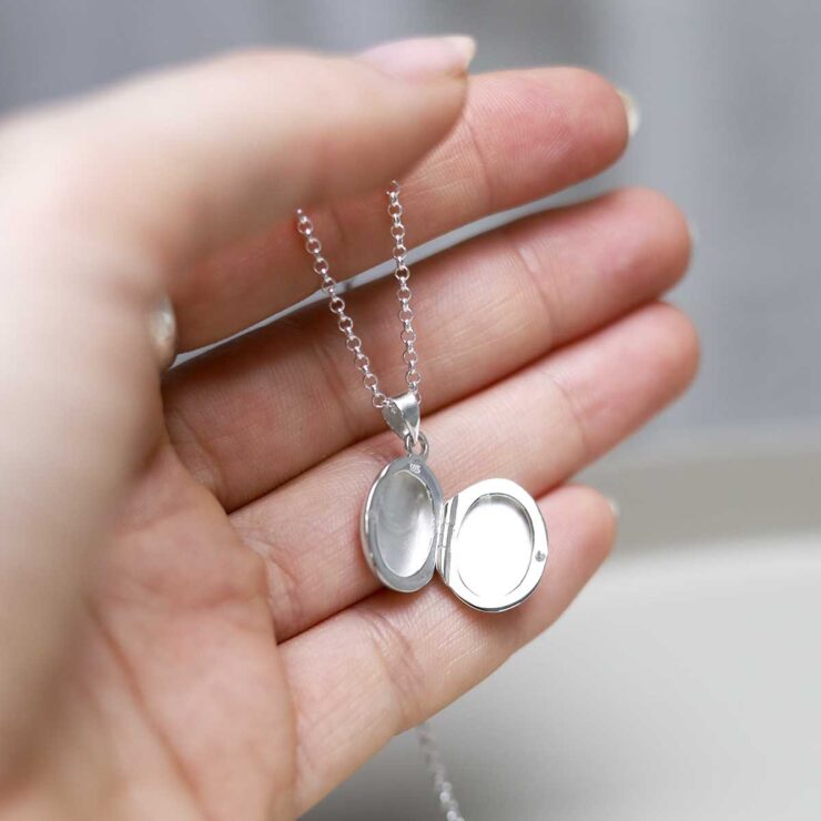 Sterling Silver Oval Locket Necklace in models hand