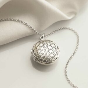 Sterling Silver Filigree Round Locket on silk background