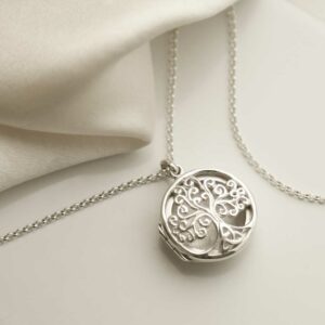 Sterling Silver Filigree Tree Locket on silk background