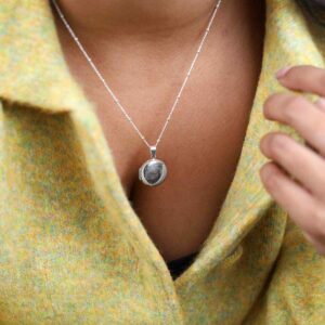 Model In Green Jacket Wearing Sterling Silver Round Locket