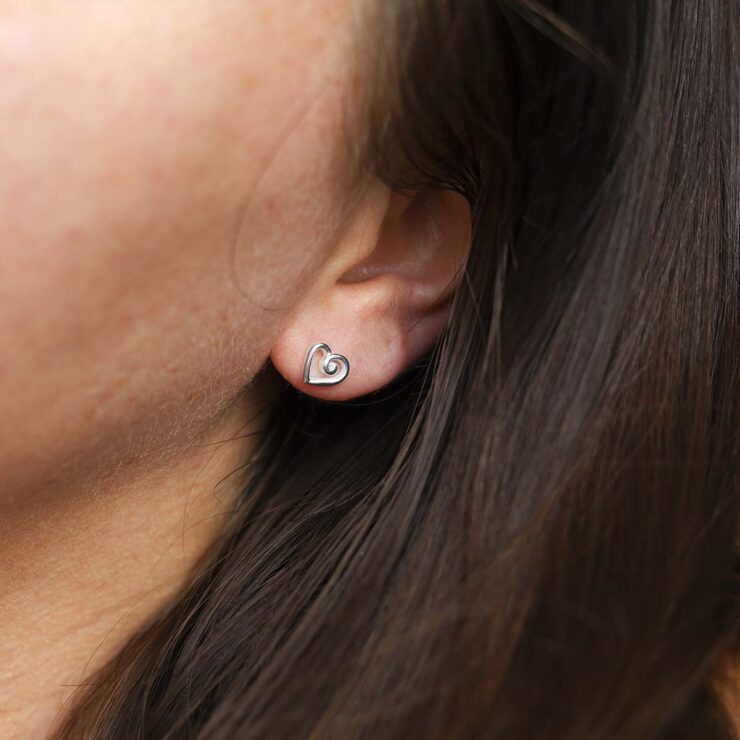 Sterling Silver Delicate Spiral Heart Earrings on model