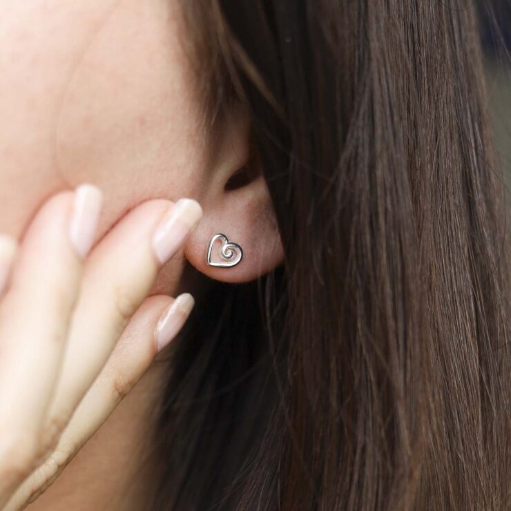 Sterling Silver Delicate Spiral Heart Earrings on model