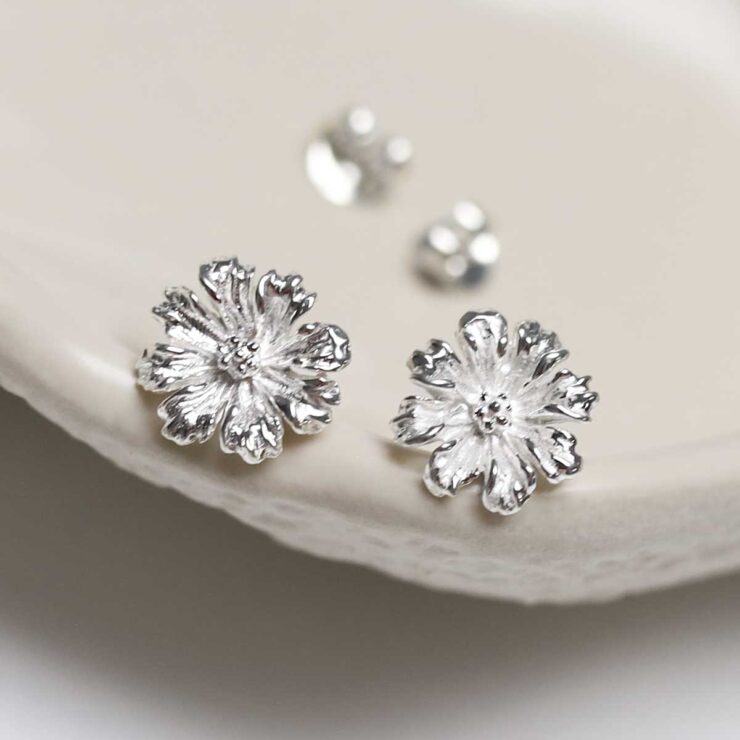 Sterling Silver Cosmos Flower Studs on jewellery dish