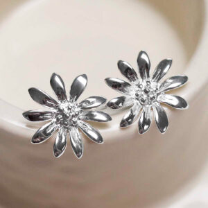 Sterling Silver Polished Daisy Stud Earrings on jewellery dish