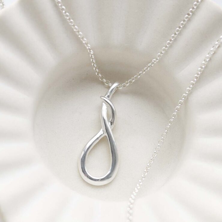 Sterling Silver Designer Loop Necklace in trinket dish