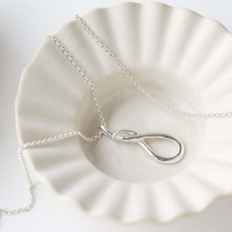 Sterling Silver Designer Loop Necklace in trinket dish
