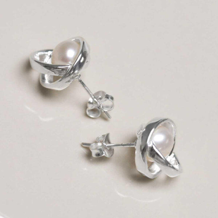 Sterling Silver Designer Round Pearl Studs on jewellery dish