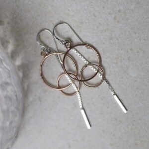 Sterling Silver Rose Gold Essential Dangly Earrings on table