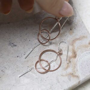 Sterling Silver Rose Gold Essential Dangly Earrings on table