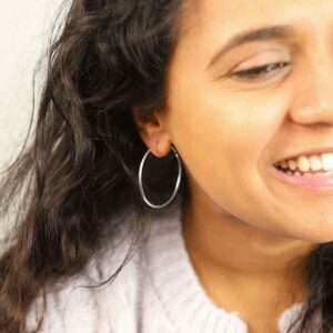 Brunette Model Wearing Sterling Silver 35mm Hoop Earrings